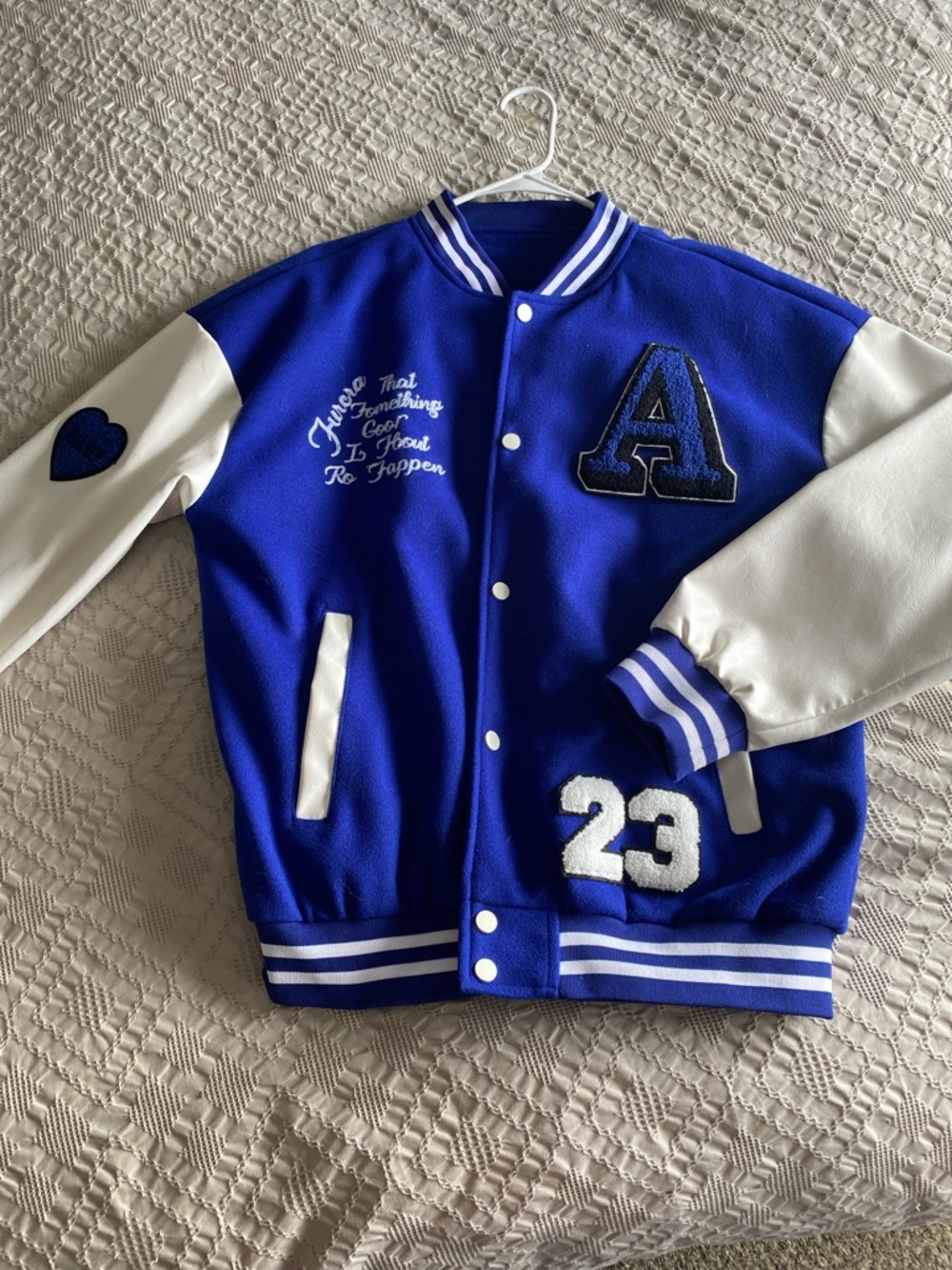 Blue & white men’s Varsity Jacket with Number 23